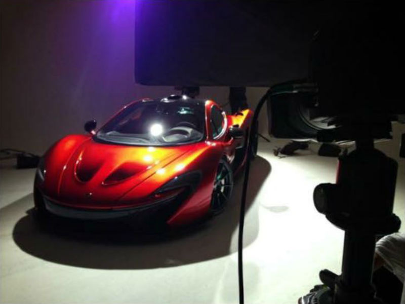 An Orange McLaren P1 In A Studio