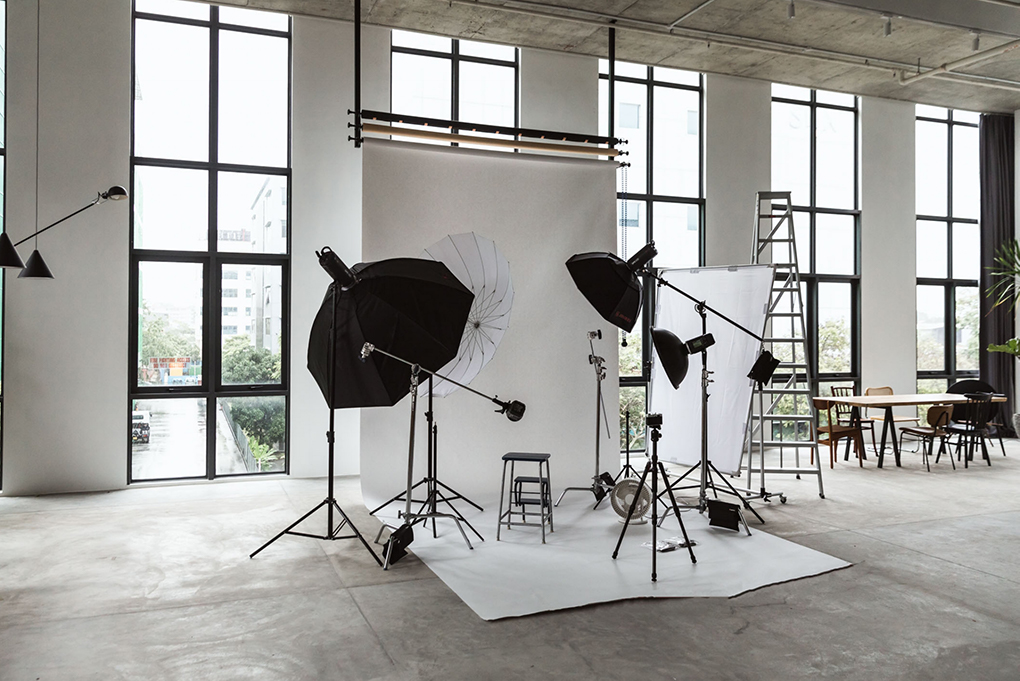 A White Backdrop With Softbox Lights & A Ladder