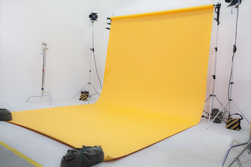 A Studio With Yellow Backdrop