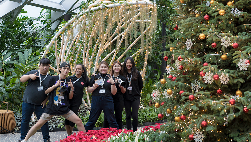 A group photo taken after a corporate video filming session at Changi Jewel