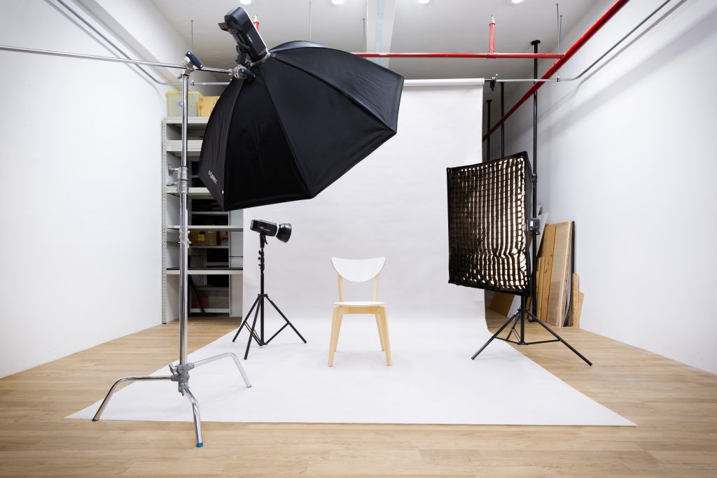 A Studio With White Backdrop & Softbox Light