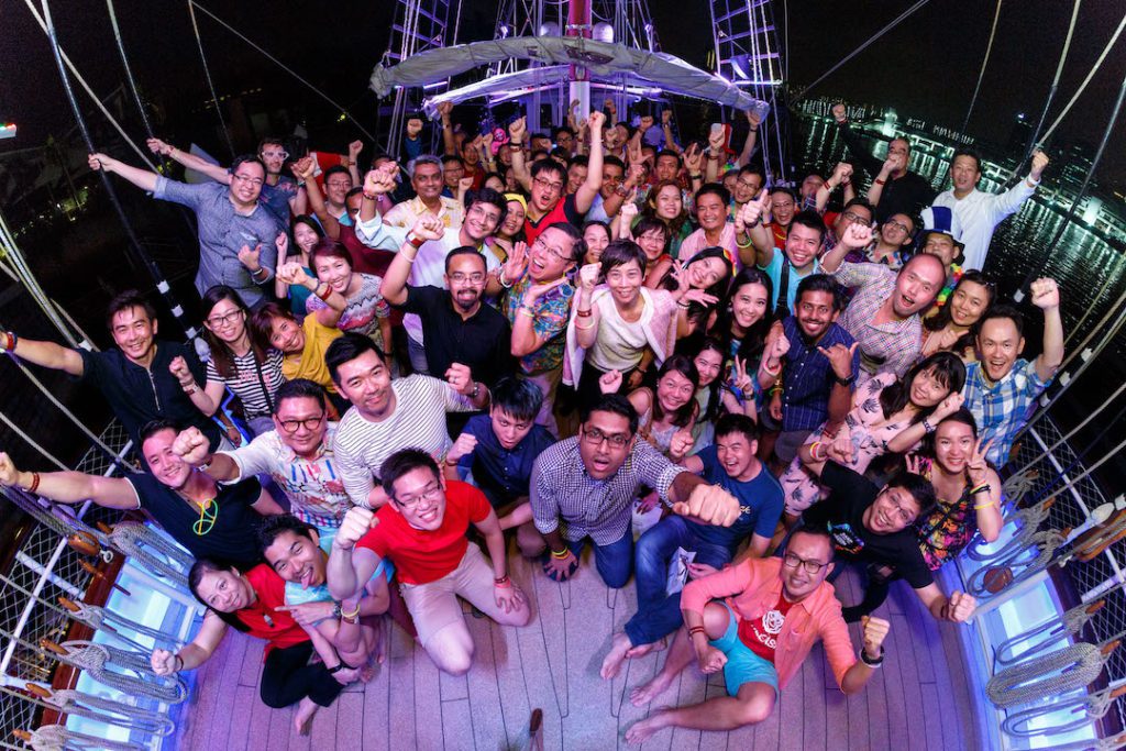 Fisheye Photo of Company Retreat at the sea