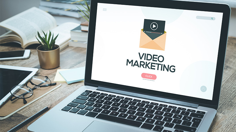 Image of laptop showing showing a video marketing