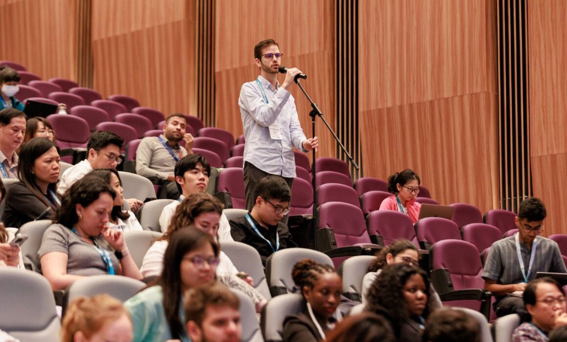 Audience member speaking at the IUBMB Enable Conference 2024, NTU Singapore.