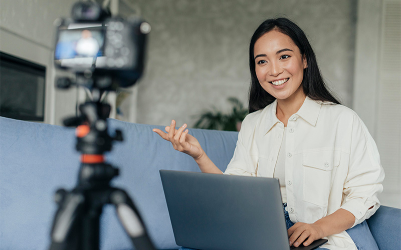 Woman recording emotional testimonial video for Vivid Snaps production.